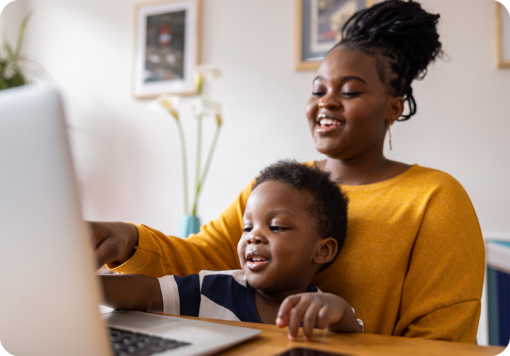 Parent with child at a computer