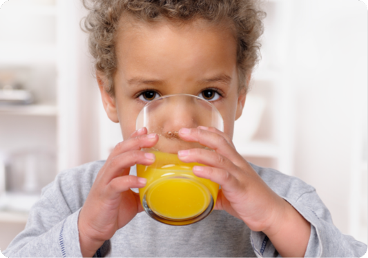 Kid drinking orange juice