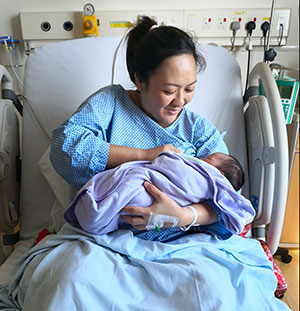 Mother breastfeeding in hospital