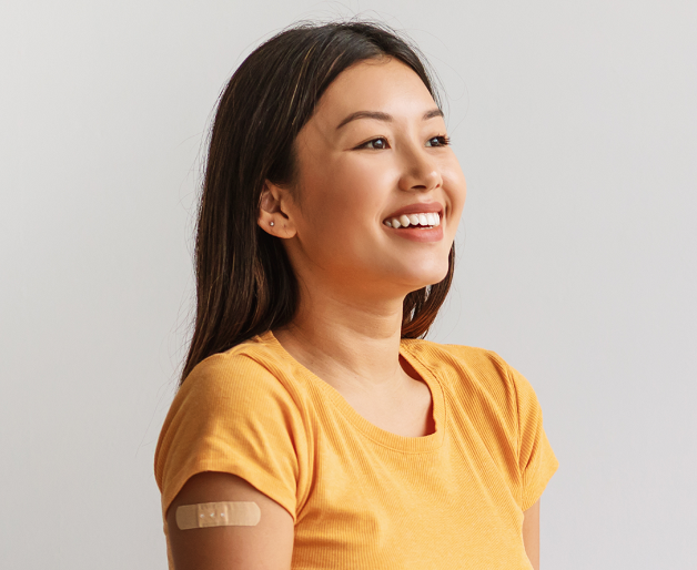 Woman with bandaid on shoulder